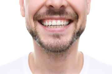 Fototapeta premium Smiling man on white background, close up