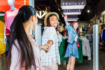 cheerful multicultural hipster girls in shopping mall, friends shopping concept