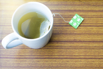 Japanese green tea on for afternoon tea time in a cup on wooden background