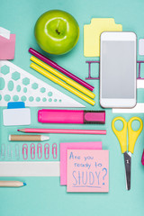 flat lay with various school supplies on colorful surface