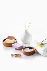 handmade soap, sea salt and towel isolated on white, spa treatment concept