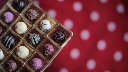 Chocolate candy box on a dotted tablecloth