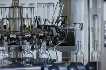 Wine bottles on the machine in production