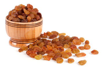 raisins in a wooden bowl isolated on white background