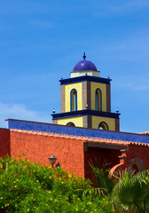 Architectural rooftops in Playa Las Americas in Teneriffe featuring tiled mosaic domes and terracotta tiles in retro Moorish style and design