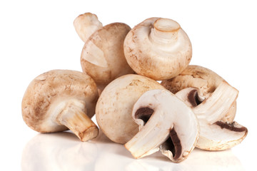 A bunch of champignon mushrooms isolated on white background