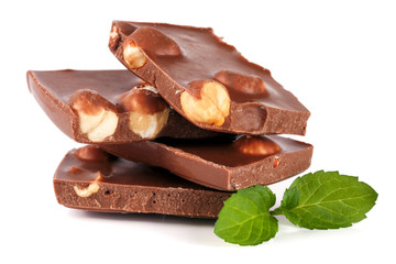 Chocolate with hazelnut and mint leaf isolated on white background