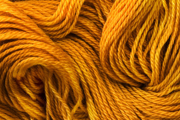 Close up the golden yellow yarn thread as abstract  background