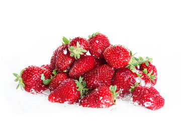 close up of heap of fresh clean strawberries isolated on white, fresh fruits background