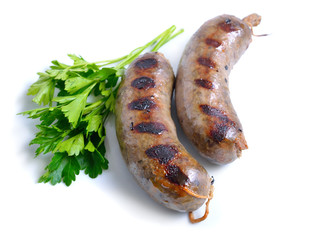 Grilled homemade liver sausages with greens isolated