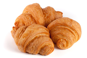 three croissant isolated on white background closeup