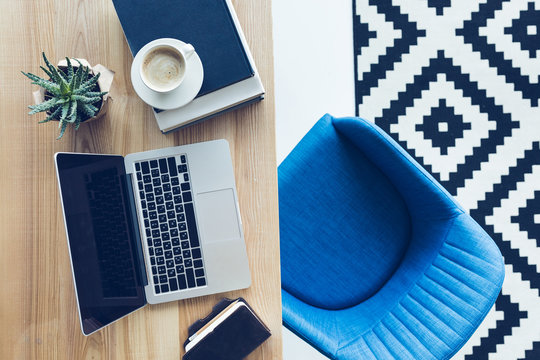 Top View Of Workplace With Laptop And Cup Of Cofffee In Home Office