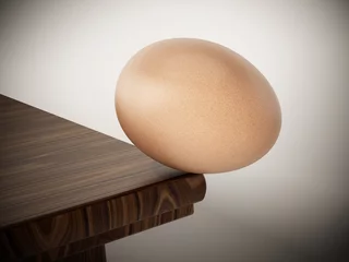 Tuinposter Egg standing at the edge of the table. 3D illustration © Destina