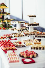 The buffet table with cakes