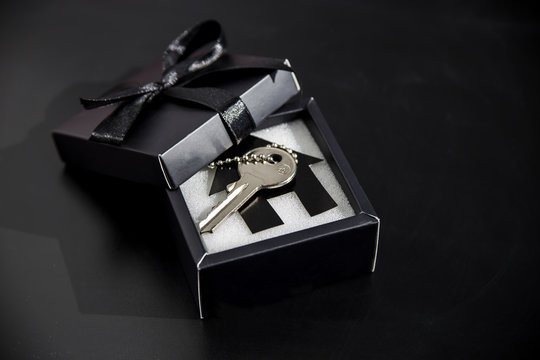 Black gift box with apartment keys