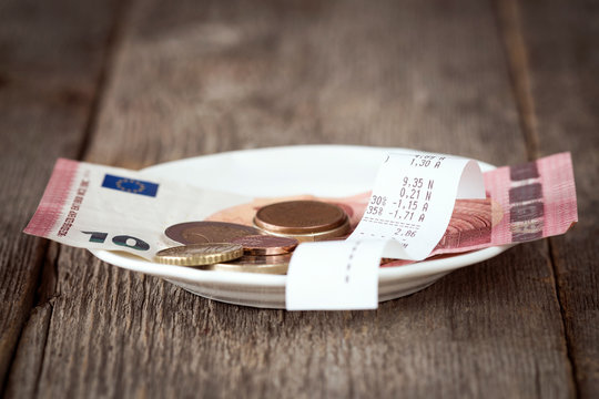 Plate with bill,money and tips