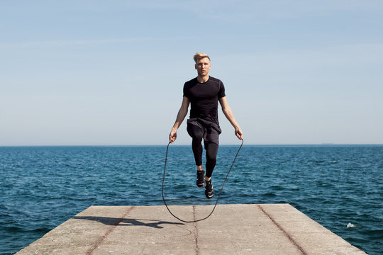 Man With Jumping Rope On Pier