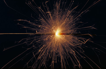 Wonderful sparklers burning up in the darkness of the night.