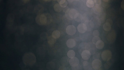 Abstract background with beautiful flickering particles. Underwater bubbles in flow with bokeh