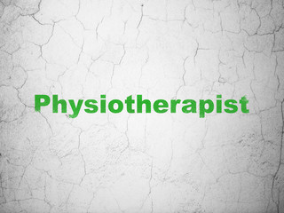 Healthcare concept: Physiotherapist on wall background
