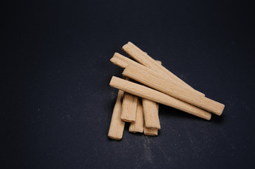 Close up creamy sticks biscuits. Delicious and tasty biscuits, cookies on black background.