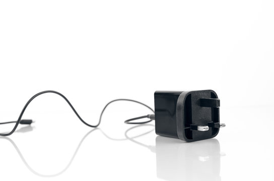 English Electricity Charger With Cable On White Background With Reflection