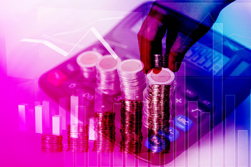 Fototapeta premium Double exposure of hand put money coins to increasing columns of coins, piles of coins arranged as a graph with coins currency and calculator