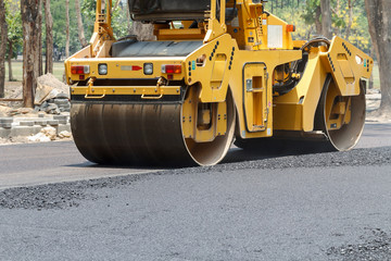 the road rollers working on the new road construction