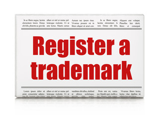 Law concept: newspaper headline Register A Trademark