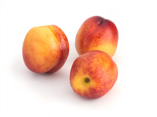 Nectarines on a white background