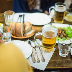 cold mug of beer with different snack