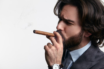 Businessman smoking cigar