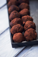 A lot of delicious round chocolate truffles. A work of culinary art