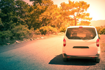 Travel car in trip. Travel vacation background concept. Toned in retro style.