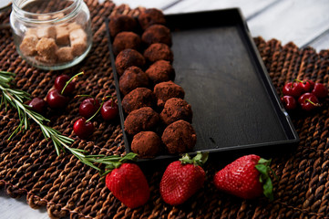A lot of delicious round chocolate truffles. A work of culinary art