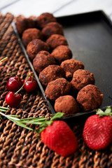 A lot of delicious round chocolate truffles. A work of culinary art
