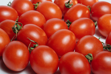 Two tomatoes, isolated on white background