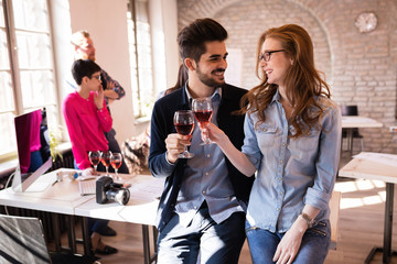 Office colleagues celebrating achievement of company goals