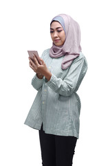 Beautiful asian muslim woman using mobile phone