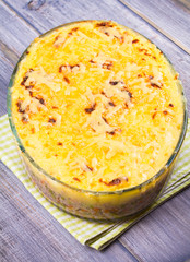Meat, potato, cheese, carrot, onion and green peas casserole. Traditional shepherd pie