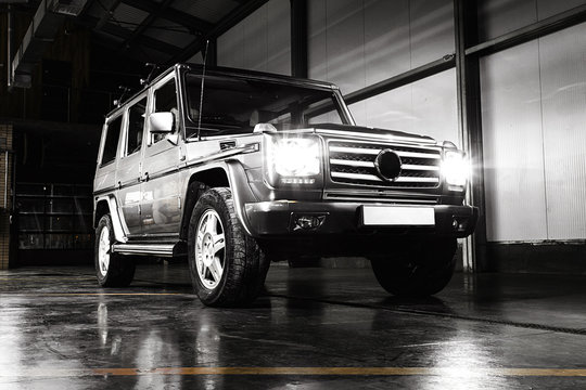 SUV Garage Interior Lights On Wet Floor