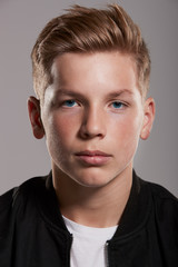 Fototapeta premium White teenage boy looking to camera, portrait, vertical