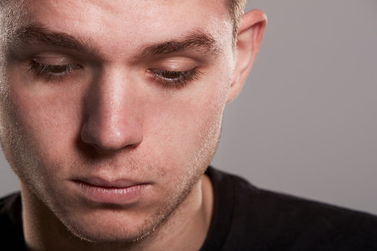 Young White Man Looking Down, Close Up