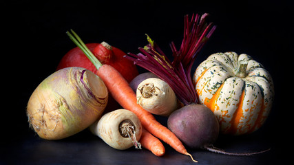 Vegetables, still life on a black background © Monkey Business