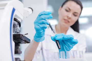 Very attentive scientist working at the lab