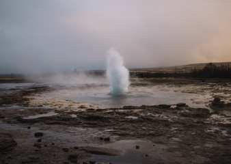 Beautiful geyser valley in Iceland.Erupting geyser
