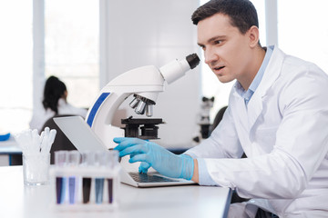 Surprised researcher looking at his computer