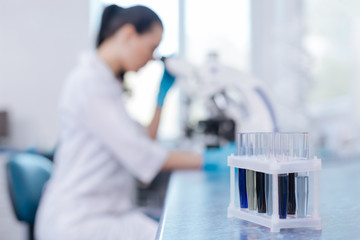 Close up photo of support with test-tubes