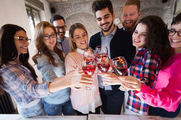 Office colleagues celebrating achievement of company goals