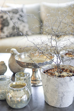 Silver vases and pot on table